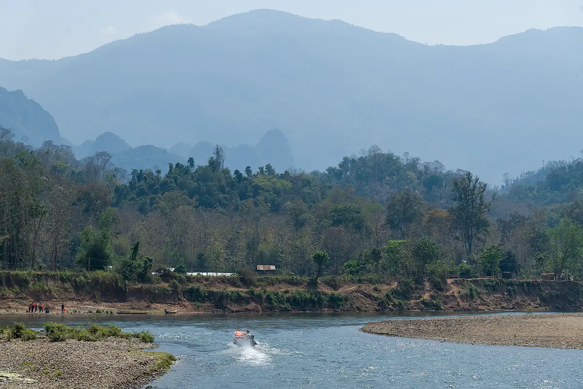 Crossing river to Madalao Elephant Sanctuary
